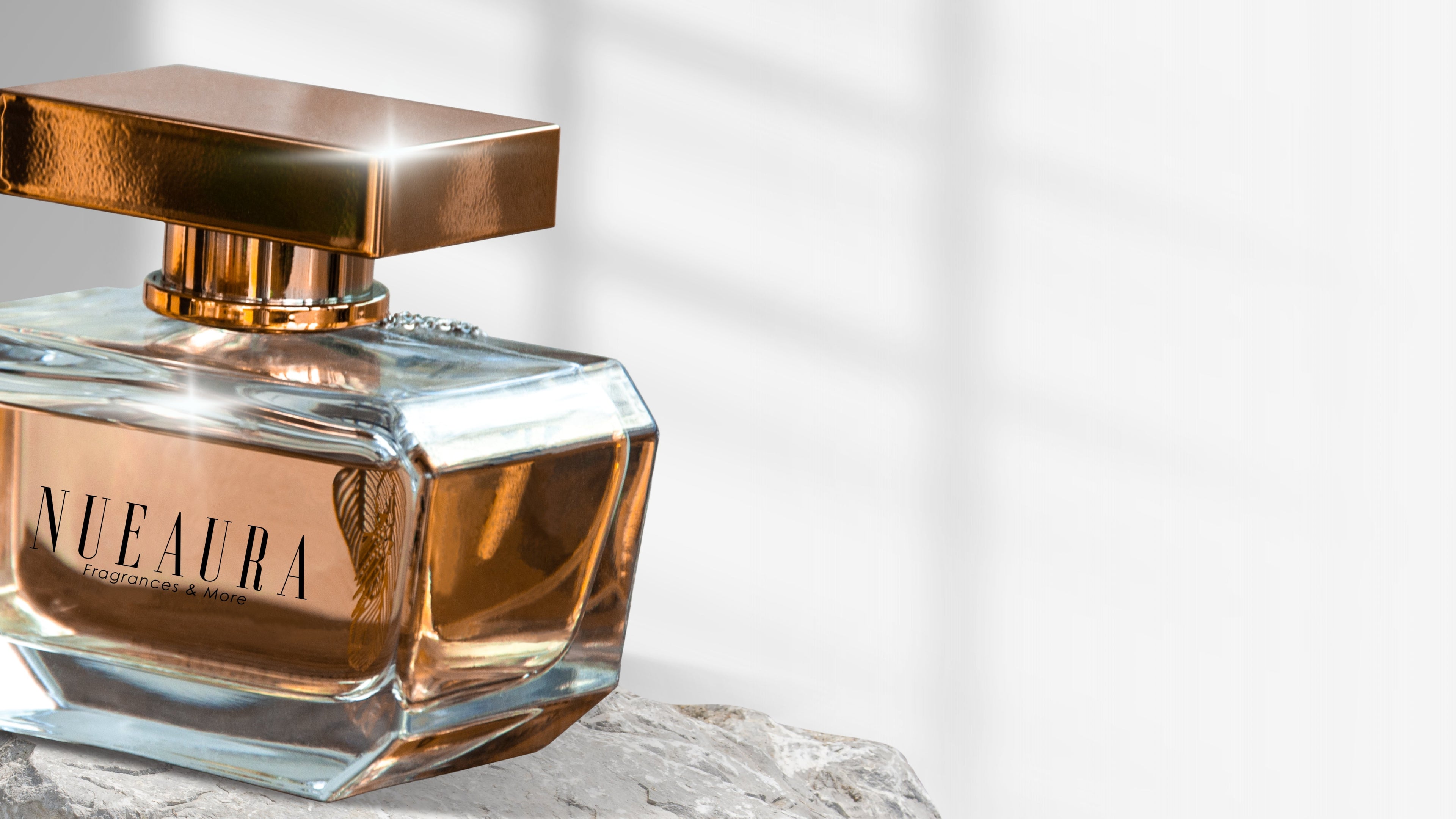 Perfume bottle with gold cap on a light background